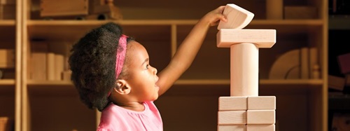 girl stacking blocks