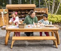 preschool kids and teacher working in outdoor art studio