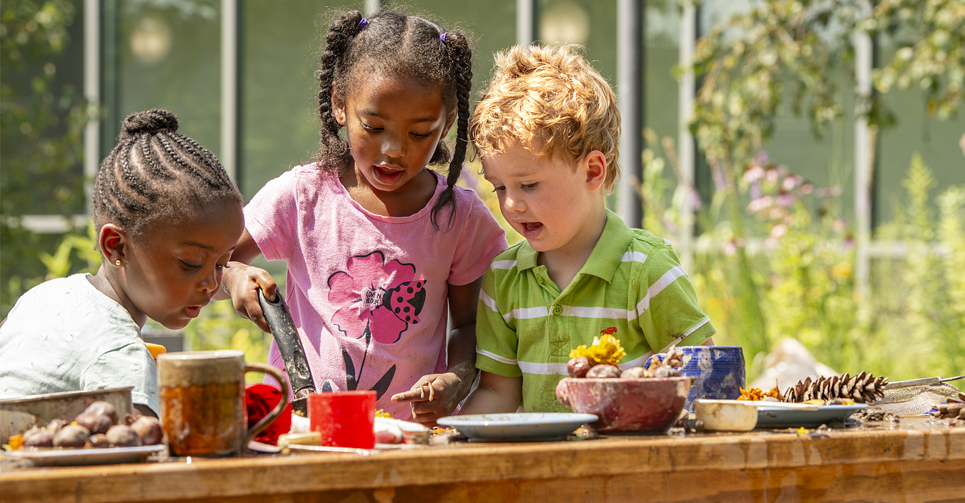 Children playing with an Outlast Kitchen table