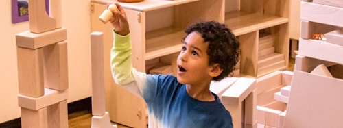 boy stacking blocks