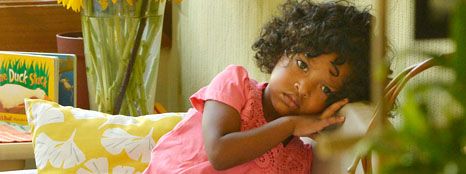 girl sitting on a small couch