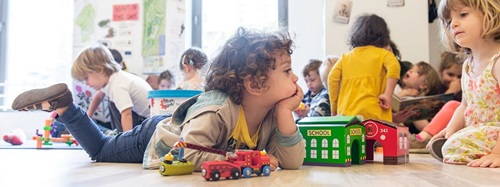 children playing with toy cars