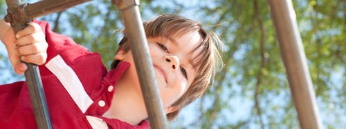 boy on a climbing frame