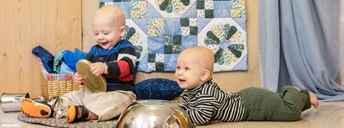 two babies playing