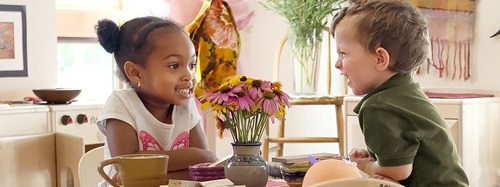 two children sitting at a table