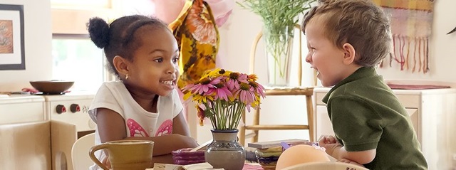 two children sitting at a table