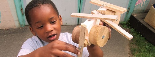 child with a toy they made