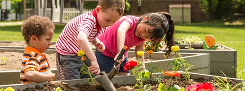 three children gardening