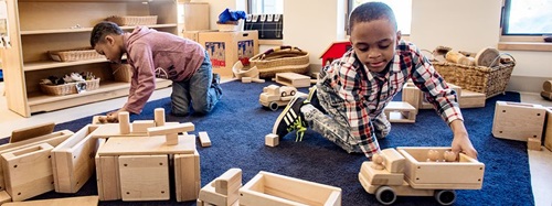 two boys playing with blocks