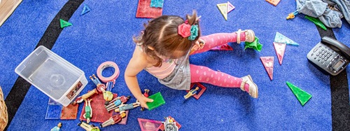 child playing on a carpet