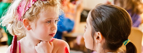 two girls talking together