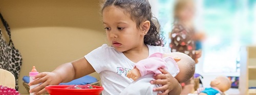 Child holding a doll