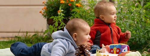 Infants playing outside.