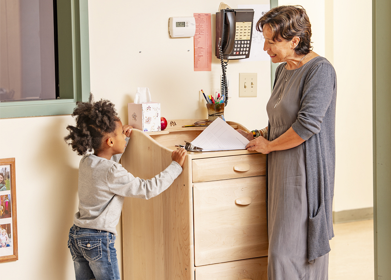 A teacher and a child at a MyPlace unit