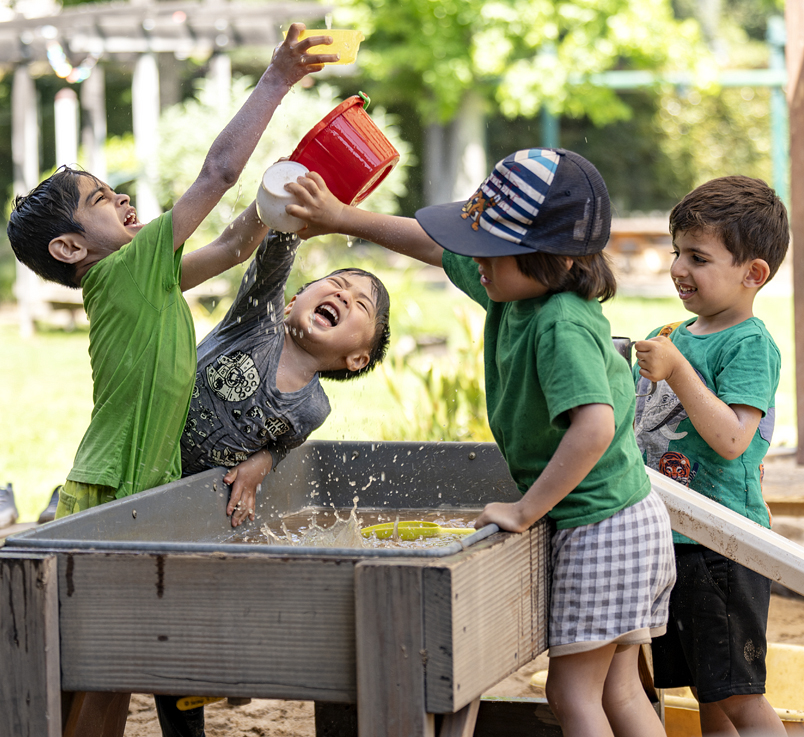Children playing with a sensory table