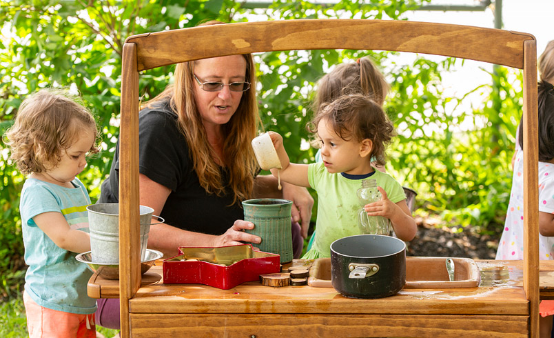 Toddlers playing at Junior Mud Kitchen sink