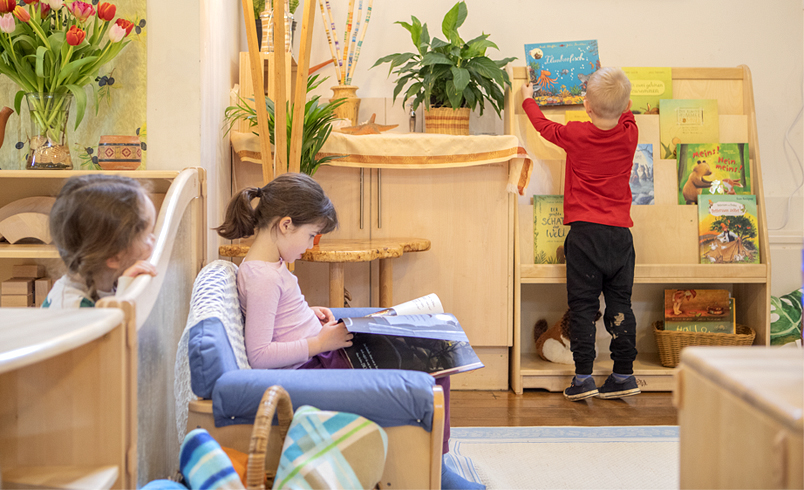 Children reading in a literacy corner