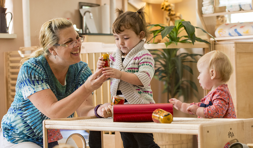 An adult caregiver with children