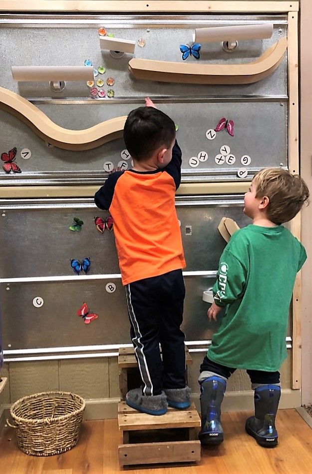 metal wall two boys