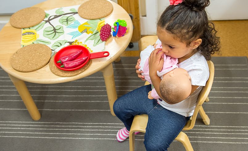 child holding a doll