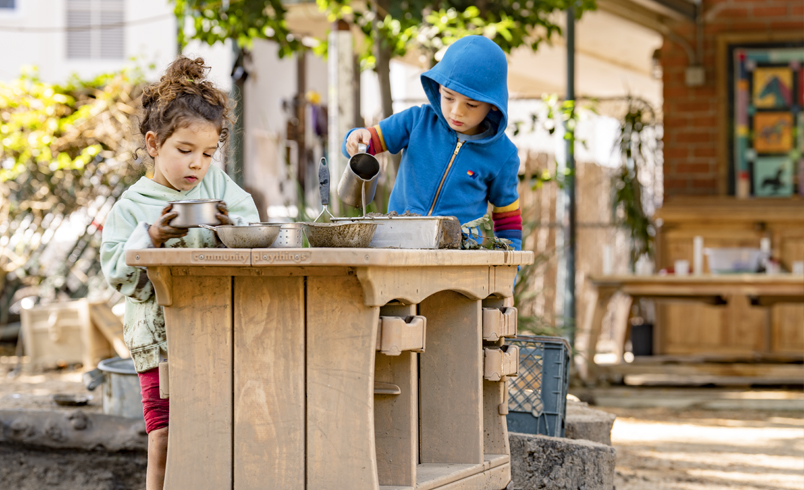 Children playing with the Outlast Mud Kitchen