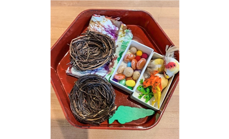 Clay tray with natural materials in it