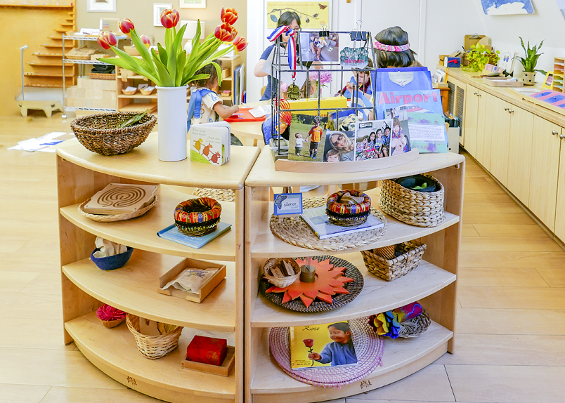 Educator teaching a student to read with plastic letters
