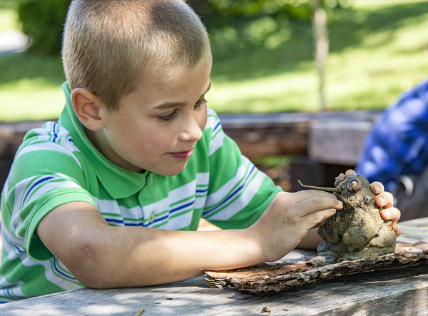 Child plays with dough