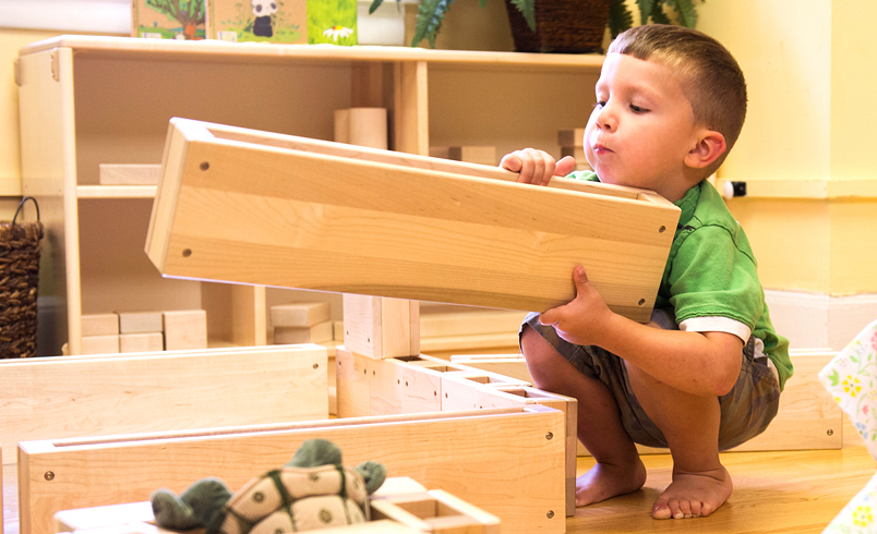 preschool boy playing with blocks