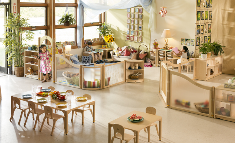 Children playing in a preschool classroom furnished by Community Playthings
