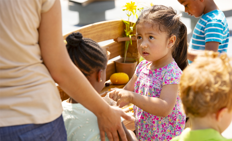 A teacher speaking to a child