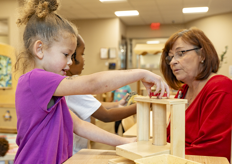 Child playing with Community Playthings Unit blocks