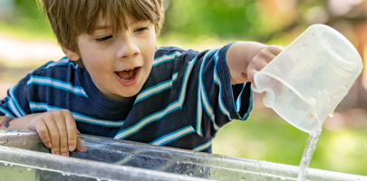 child pouring water 
