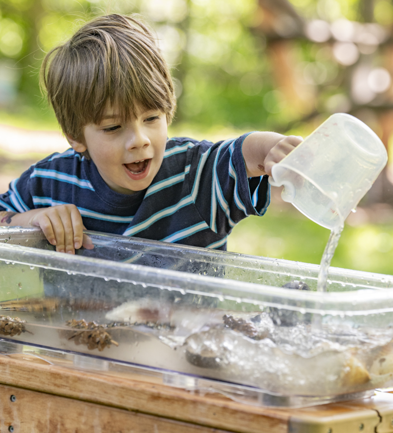 A child playing with a Community Playthings Cascade