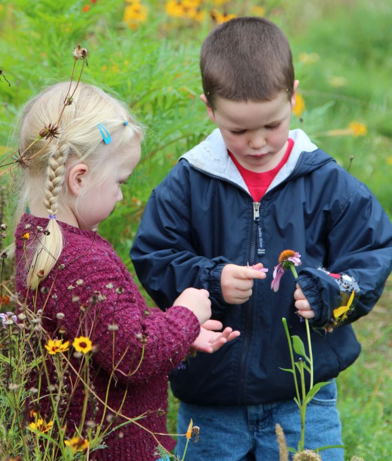 Children making nature bracelets