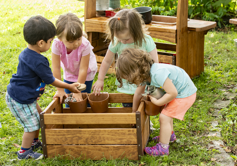 Children playing with an Outlast crate