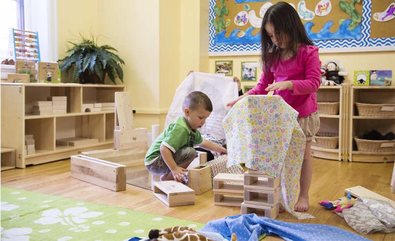 Children playing with mini hollow blocks inside