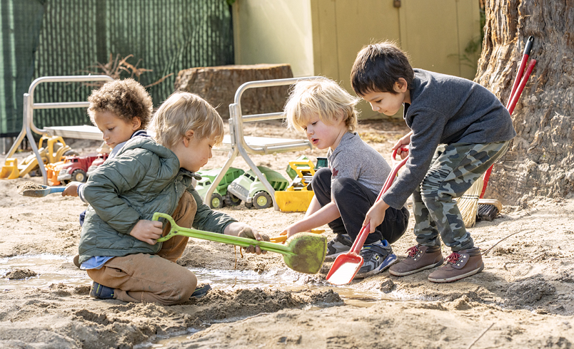 Children digging in a sand pit