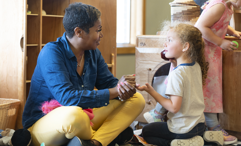 Teacher and child talking