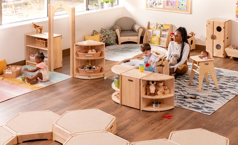 Teacher observing toddlers at play