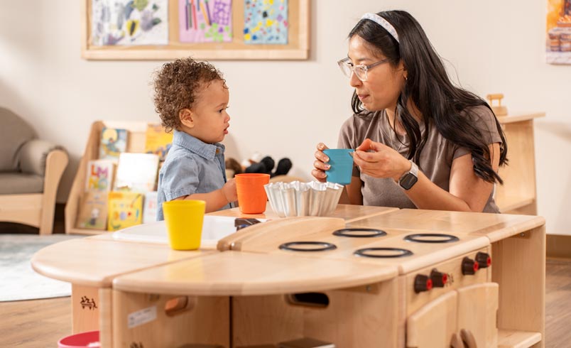 Teacher interacting with toddler