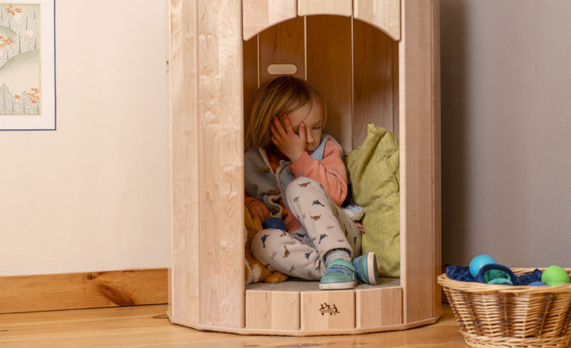 Child calming herself in Calm Nest