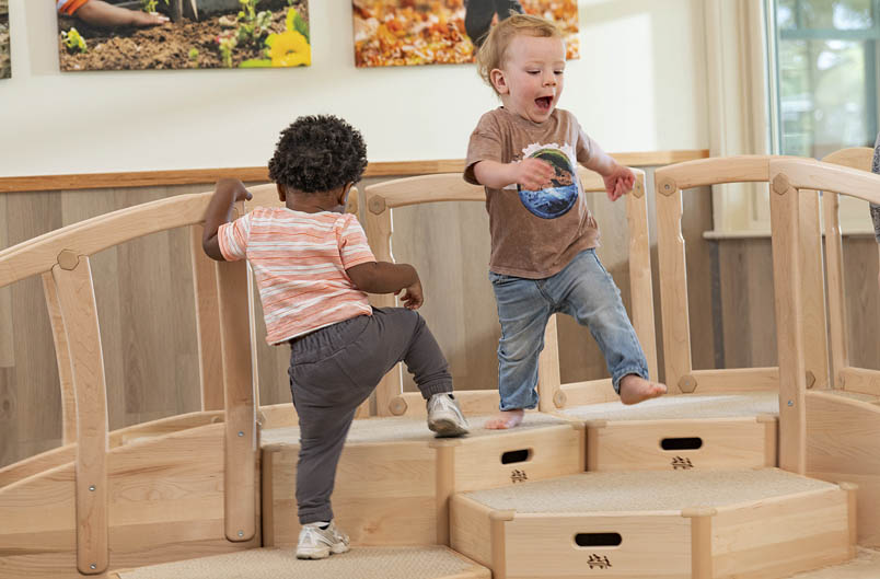 Two children playing on Toddler climber