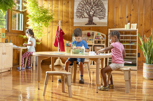 Children sitting on Grow-Right Stools in a classroom