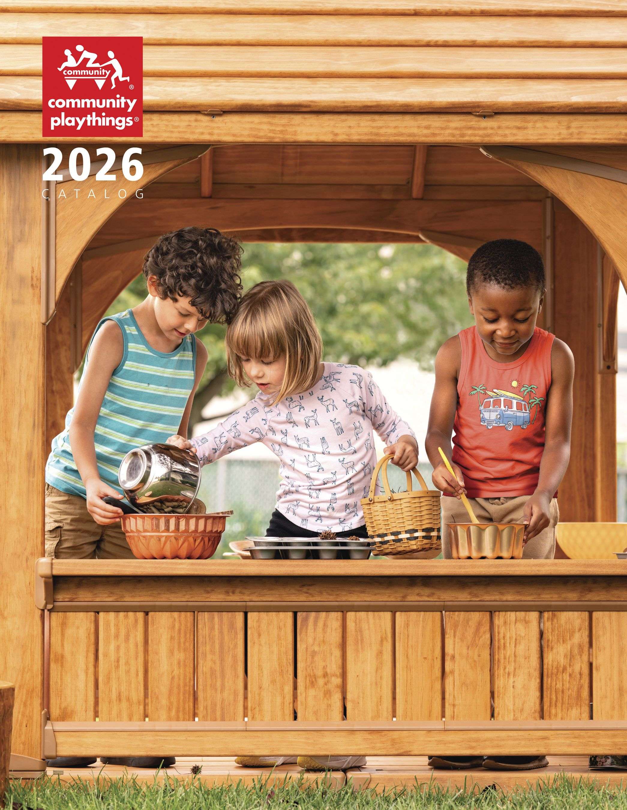 Three children playing with bowls and spoons in a wooden playhouse. Community Playthings 2026 Catalog.