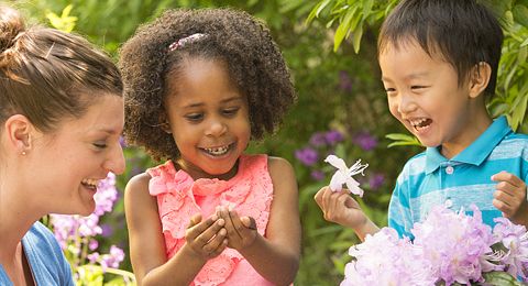 two children holding flowers