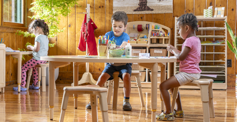 Children doing a craft at a table