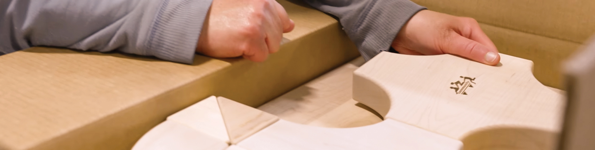 Woman's hands packing Community Playthings blocks