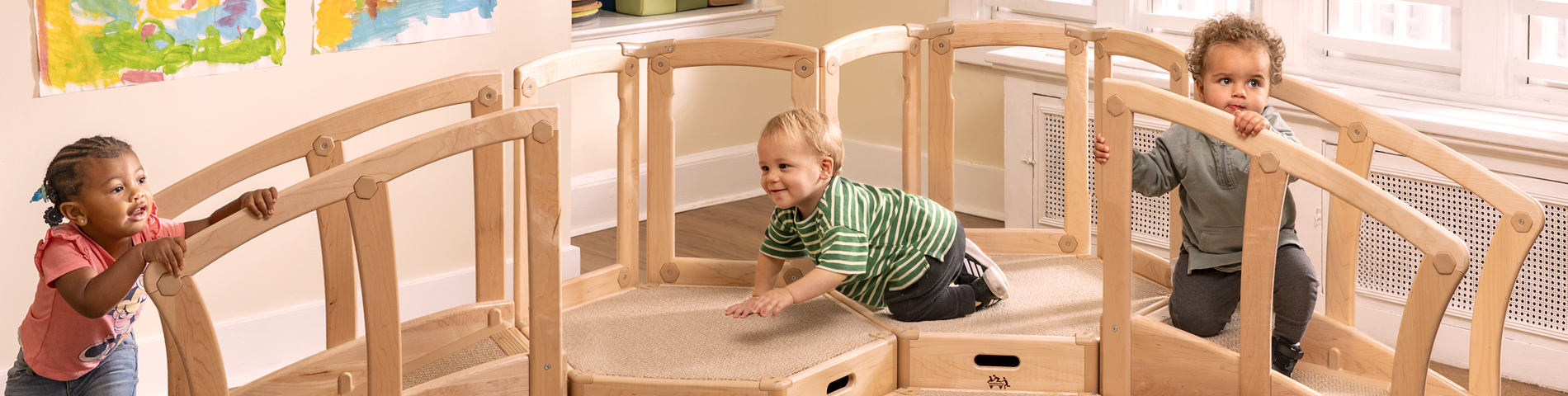 Children climbing on the Toddler Climber
