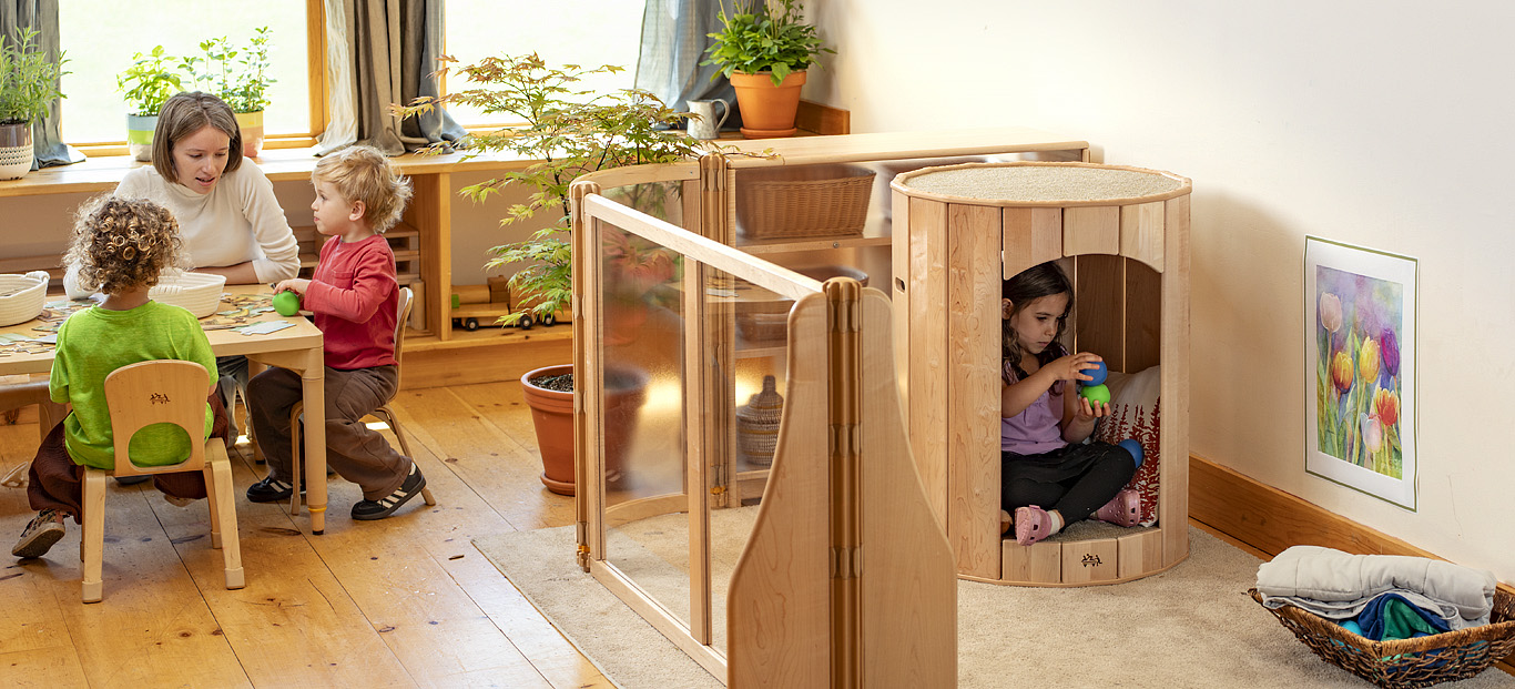 A child playing in the Community Playthings Calming Nest